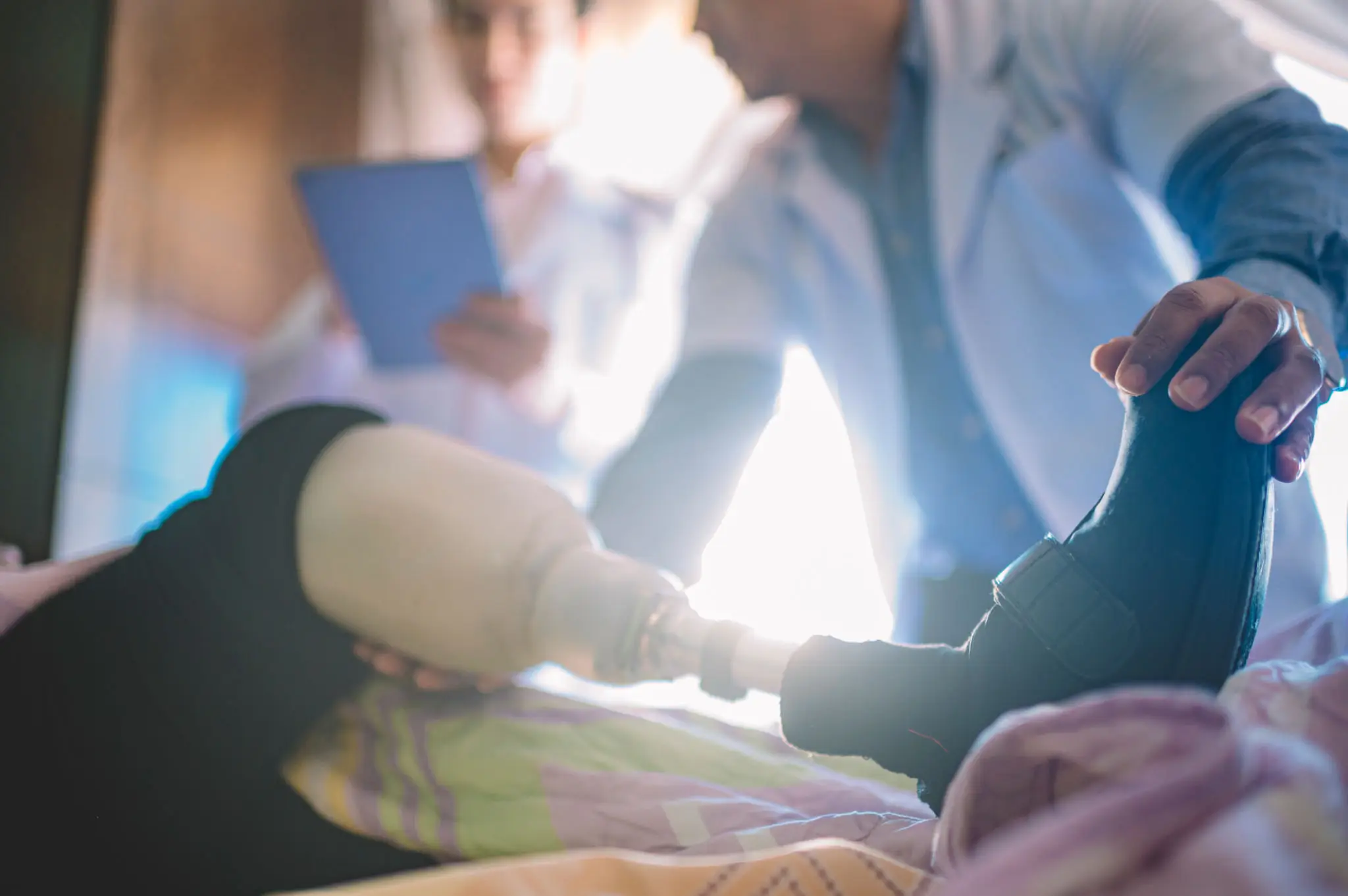 Medical professionals attending to a patient in a clinical setting.